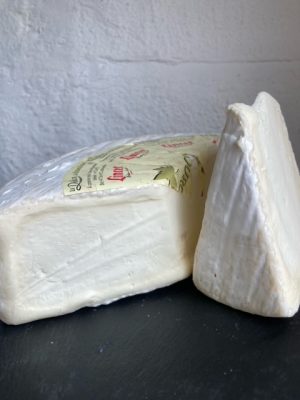 Two pieces of Delice de Bourgogne next to each other